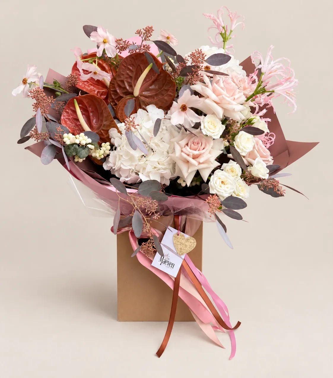 Maeven Flower signature arrangement in blush, ivory and rust tones.